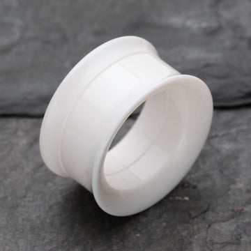 Detail View 1 of A Pair of Solid UV Smooth Flared Screw-Fit Ear Gauge Tunnel Plug-White